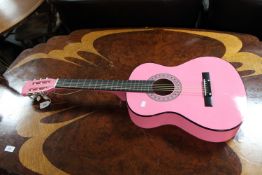 A Martin Smith acoustic guitar (pink)