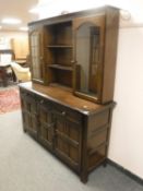 An Ercol oak kitchen dresser,