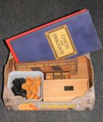 A box containing Lerdy boxed chess pieces and board, draughts set,