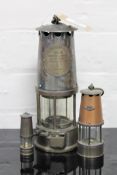 A Eccles Protector miner's lamp Type SL together with two miniature miner's lamps