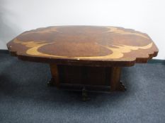 An inlaid walnut Art Deco pedestal dining table