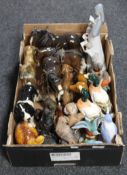 A box containing assorted china and resin animal figures,