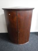 A Georgian mahogany double door corner cupboard