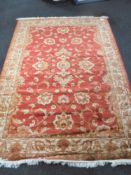 A Ziegler rug on red ground,