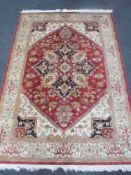 A Heriz rug on red ground,