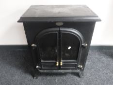 A Dimplex electric fire in the form of a stove