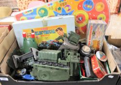 A box containing a Merit electrical outfit kit, pot luck pinball machine, plastic military vehicles,