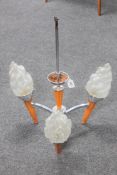 An Art Deco chrome three way light fitting with flame shades