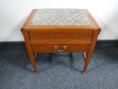 An Edwardian mahogany piano stool fitted a drawer