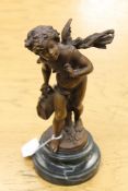 A bronze cherub on marble plinth, height 27 cm.