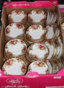 A box containing a large quantity of Royal Albert Old Country Roses saucers