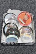 A box containing six vintage glass paperweights,