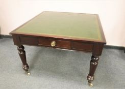 A Victorian mahogany library table with tooled green leather top, 104 cm x 107 cm.