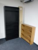 A black ash bookcase together with a teak effect bookcase and a boxed flatpack bookcase