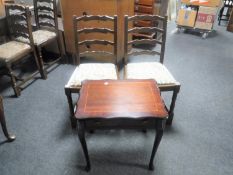 A pair of oak ladder back dining chairs together with an inlaid mahogany occasional table fitted a