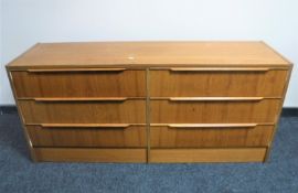 A 20th century teak six drawer chest CONDITION REPORT: 67cm high by 147cm wide by