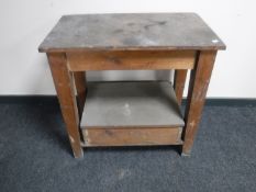 An antique pine two tier work table