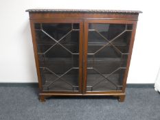 A late Victorian mahogany double door glazed bookcase