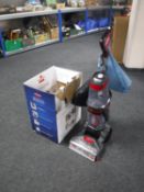 A boxed Bissel Pro Heat Revolution carpet washer