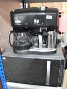 A Delonghi Caffe Nabucco coffee machine together with a Kenwood microwave