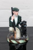 A Royal Doulton china figurine : The Gamekeeper, HN 2879, height 26 cm.