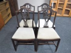 A set of four mahogany Hepplewhite style dining chairs