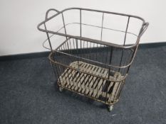 An early 20th century metal draper's trolley on castors