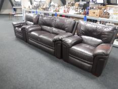 A three piece brown leather lounge suite
