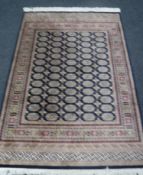 A Bokhara rug on blue ground,