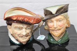 Two Royal Doulton character jugs : Robin Hood, height 17 cm, and Drake, height 15 cm.