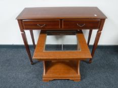 A reproduction inlaid mahogany hall table fitted two drawers together with a glass topped lamp