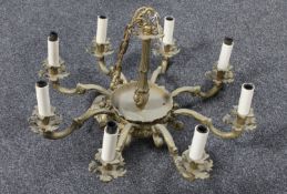 A continental gilt metal eight way light fitting
