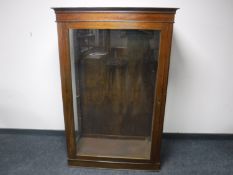 An early 20th century glazed oak shop cabinet,