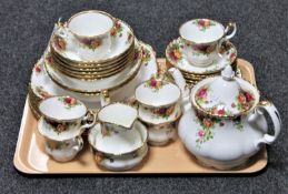A tray containing thirty-six pieces of Royal Albert Old Country Roses tea and dinner china