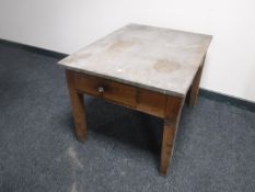 An antique pine coffee table fitted a drawer