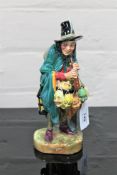 A Royal Doulton china figurine : The Mask Seller, HN 2103, height 23 cm.
