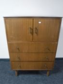A mid 20th century teak linen chest