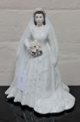 A Royal Worcester china figurine : Her Majesty Queen Elizabeth II (Diamond Jubilee Edition),