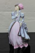 A Royal Worcester china figurine : Masquerade, height 20 cm.