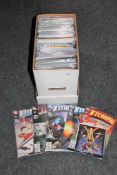 A box containing 21st century comics including Green Arrow, Batman,