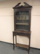 An antique Chippendale style mahogany cabinet on stand fitted with a drawer, width 77 cm.