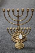 Two brass menorahs