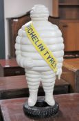 A cast iron Michelin tyres figure CONDITION REPORT: 59cm high and 25cm wide.