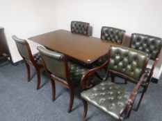 A mid 20th century teak G Plan sideboard and table together with a set of six green buttoned