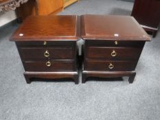 A pair of Stag Minstrel two drawer bedside chests with slide
