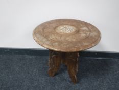 A carved Eastern folding occasional table