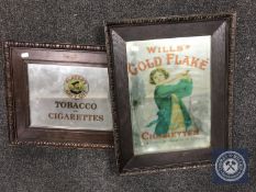 An early 20th century and later oak framed mirror bearing 