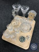 A tray of glass mantel clock, crystal candle holders, decanters, paperweights,
