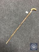 A carved wooden walking cane