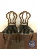 A pair of French walnut dining chairs in striped fabric